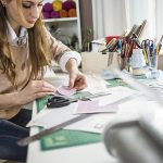 Artisan woman working in her atelier, creative business owner